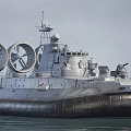 Military Hovercraft With Large Rotating Fans Radar System And Cannons On Water