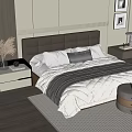 Modern Double Bed with Gray Upholstered Headboard White Gray Bedding Nightstands and Decorative Paintings