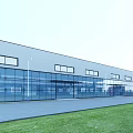 Modern Industrial Factory Building With Glass Walls Multiple Windows Road Grass And Red Truck