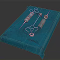 High Quality Medical Instruments Including Syringes And Metal Components On Blue Pad