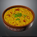 Delicious Yellow Creamy Dish in Red Patterned Bowl with Fresh Green Cilantro and Red Garnish