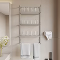 Stylish Bathroom Space With Metal Shelf Glass Cups Hair Dryer And Gray Towels