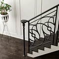Decorative Iron Staircase Railing With Intricate Scrollwork In Elegant Interior With Sofa And Lamp