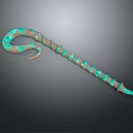 Turquoise And Brown Snake Shaped Decorative Sculpture On Dark Background