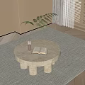 Round Stone Coffee Table With Cylindrical Legs Open Book Green Plant On Light Rug
