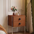 Wooden Bedside Table With Drawers Black Knobs Metal Legs And Vase With Flowers