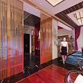 Chinese Style Clubhouse Interior With Mahogany Furniture Red Walls Chandelier And Circular Decor