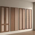 Multiple Brown Wooden And Rattan Wardrobe Doors Mounted On Wall With Natural Light