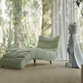 Light Green Chaise Lounge in Bright Room With Lush Forest View and White Statue