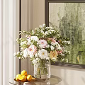 Beautiful White Pink Yellow Flowers in Glass Vase with Green Leaves near Curtain and Painting