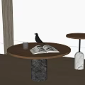 Round Wooden Coffee Tables With Dark And White Marble Bases Open Book Black Bird Decor