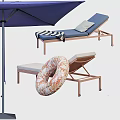 Outdoor Blue Lounge Chair With Metal Frame Blue Umbrella Striped Towel And Float Ring