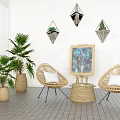 Wicker Chair And Small Table Set With Potted Plants Painting And Diamond Wall Decor