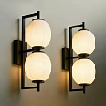 Two Wall Sconces With Double Round Shades Black Metal Frame On Gray Wall Soft Lighting