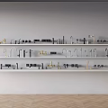 Water Faucet Samples Neatly Arranged On White Shelves With Light Colored Walls And Wooden Flooring