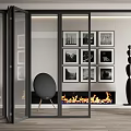 Glass Folding Doors In Modern Living Room Interior With Framed Artworks Fireplace And Accent Chair