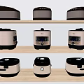 Various Styles of Kitchen Appliances Rice Cookers Displayed on Shelves