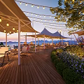 Garden Landscape With Wooden Deck White Canopies String Lights Loungers Greenery And Evening Mountain Views