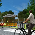 Entrance Gate Area With Roofed Pavilion Red Yellow Benches Trees And Bicycle Rider