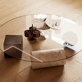 Oval Glass Coffee Table With Marble Base And Decorative Magazines On Wooden Floor