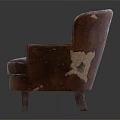Vintage Brown Single Sofa With Worn Leather Surface And Wooden Legs