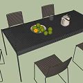 Outdoor Table with Chairs and Tabletop Setup Featuring White Teapot Bowl of Limes and Glass