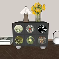Black Bedside Table With Six Patterned Drawers Lamp Sunflowers And Books
