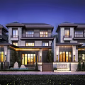 Modern Townhouse Row Exterior With Warm Evening Lighting And Landscaped Front Yard