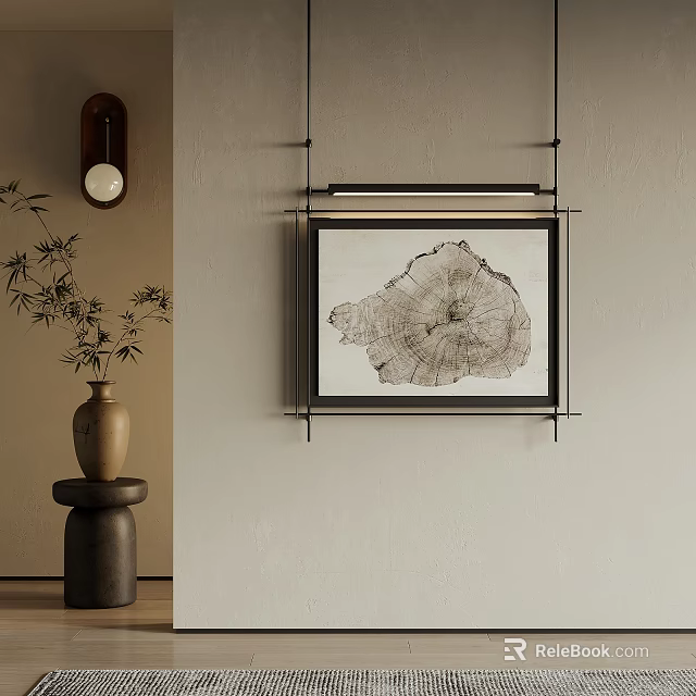 Tree Ring Artwork in Black Frame Hanging on Beige Wall with Bamboo Vase 3d model