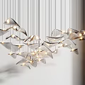 Modern Chandelier with Multiple Leaf Shaped Metallic Pieces and Illuminated Warm Glow for Contemporary Interiors