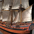 Detailed Wooden Ship Model With Multiple White Sails Brown Hull And Swedish Flag