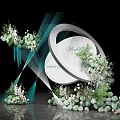 Wedding Decor Setup With White Circular Arch Green White Flowers And Blue Ribbons