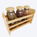 Clear Glass Spice Jars with Wooden Lids on Two Tiered Wooden Rack Storing Grains