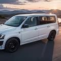 White SUV With Black Wheels On Road During Sunset Mountain Lake View