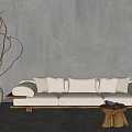 Beige Three Seater Sofa With Wooden Base Plush Pillows And Small Wooden Coffee Table
