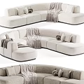 Modern Curved Sectional Sofa With Neutral Tone Upholstery Decorative Pillows And Soft Blankets