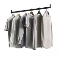 Light Colored Shirts On Hangers Hanging From Black Rod With Various Styles