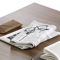 Decorative Ornament Combination With Books Eyeglasses Newspaper Tray Glass Bottle And Cups On Wooden Table