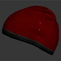 Two Gray And Red Velvet Fabric Hats With Stitched Edges On Dark Background