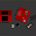Red Open Portable Laptop with Black Screen Game Cartridges and Stickers