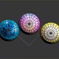 Blue Pink Yellow Disco Balls With Reflective Surface Connected By White Strings On Dark Background