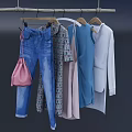Various Stylish Clothes Hanging on Hangers with Denim and Patterned Designs