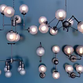 Various Modern Pendant Lights with Spherical Clear Bulbs and Metal Frames in Multiple Arrangements 3d model