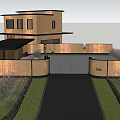 Evening View Of Architectural Courtyard With Landscaped Trees Circular Stone Walls And Warm Lighting
