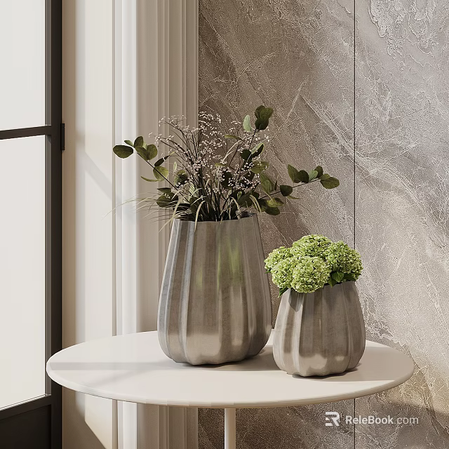 Textured Silver Vases With Green Plants And Spherical Flowers On White Round Table 3d model 