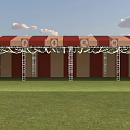Outdoor Red and White Striped Canopy Structure with Metal Ladders Green Grass Field Cloudy Sky