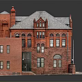 Historic Red Brick Building With Gabled Roof Arched Windows And Stone Steps