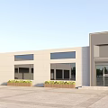 Modern Office Building Exterior Featuring Spacious Plaza Front Entrance and Large Windows Under Blue Sky