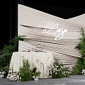 Luxe Check in Photo Spot With Beige Pleated Backdrop Green Plants And White Flowers