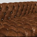 Classic Brown Tufted Leather Sofa With Button Details And Sturdy Wooden Legs